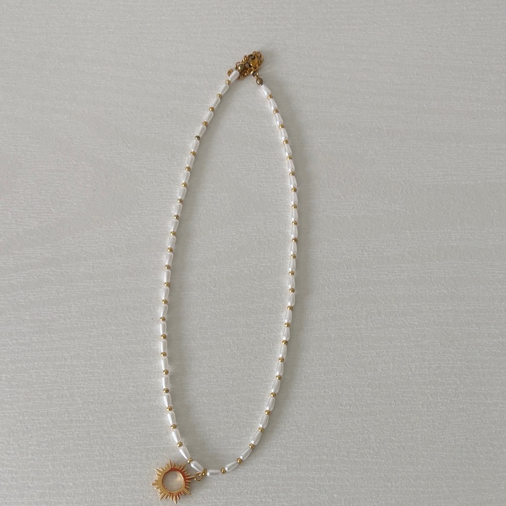 Gold and White Sunburst Pendant Necklace